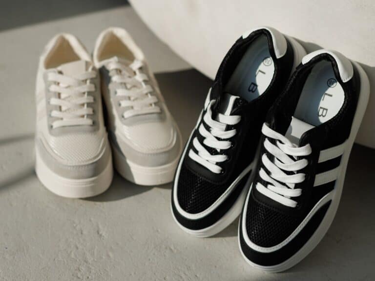 Мінімалізм у моді: білі та чорні шкіряні кеди як основа стилю